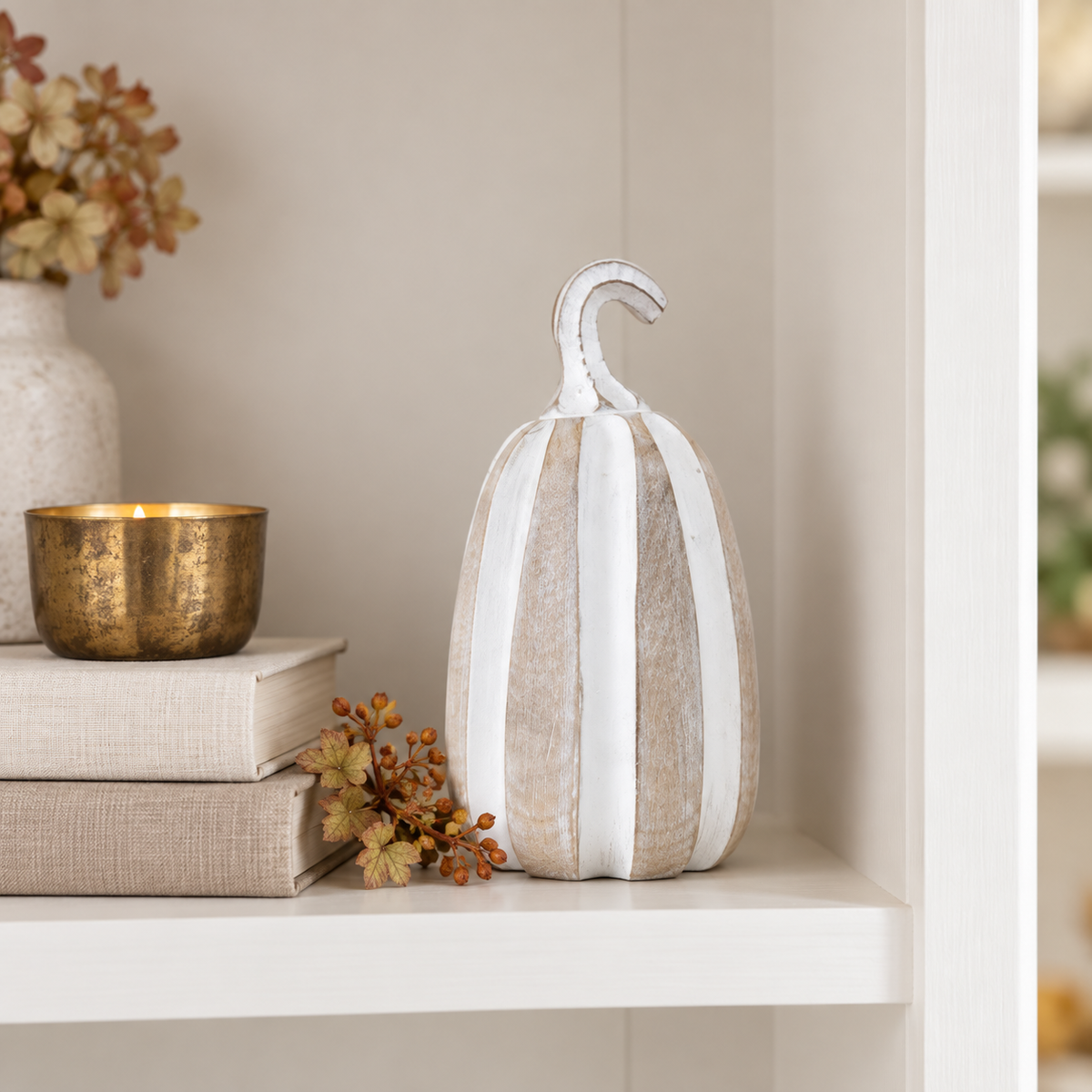 Pippin tall whitewashed pumpkin displayed on an elegant fall bookshelf