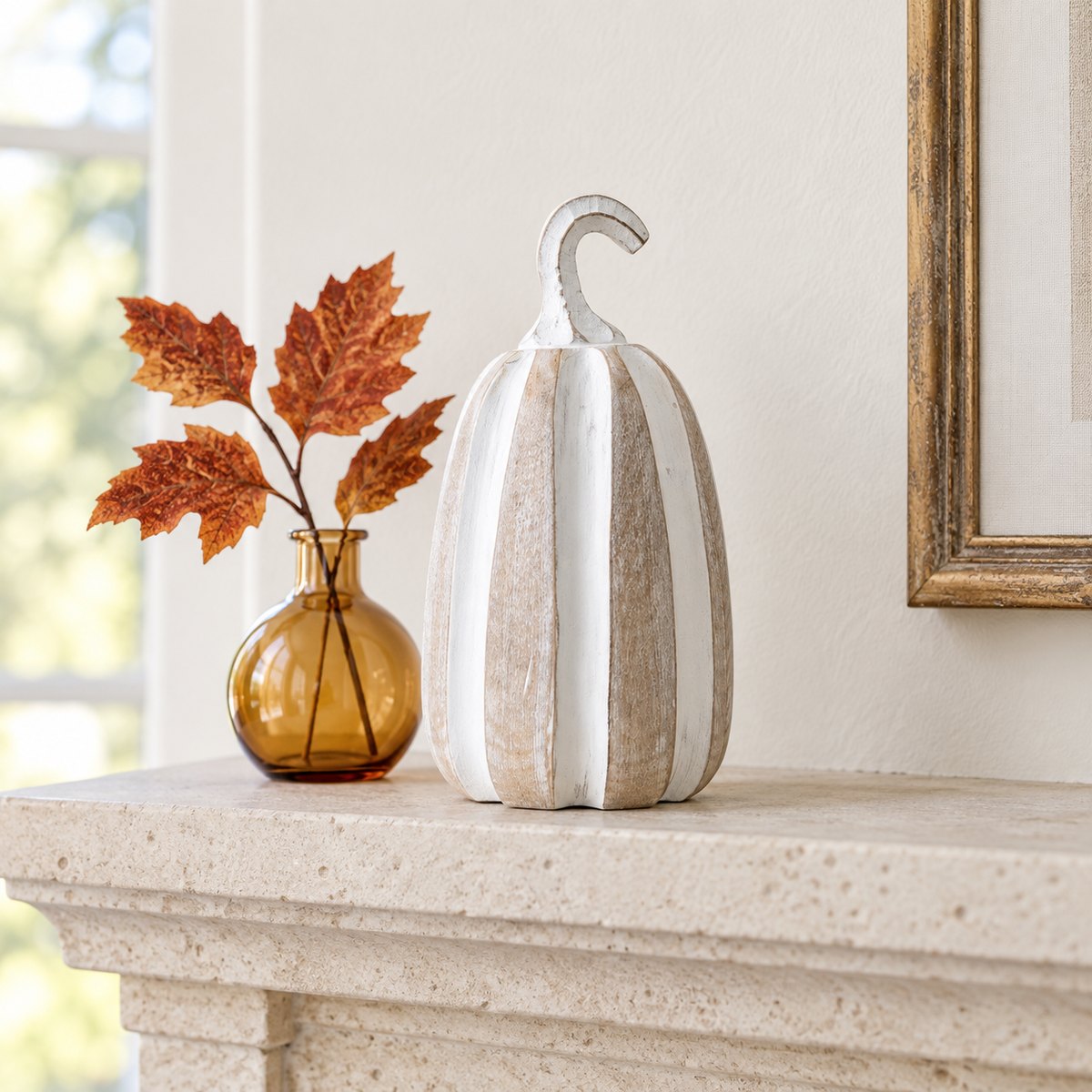 Pippin tall whitewashed pumpkin styled on a bright fall fireplace mantel